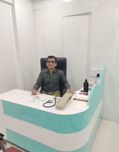 Dr. Satish Chavan at the consultation desk at Health Care Clinic, Baner